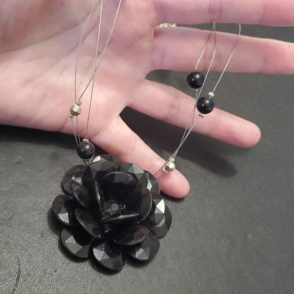 Silver tone black flower floating necklace - Picture 11 of 11